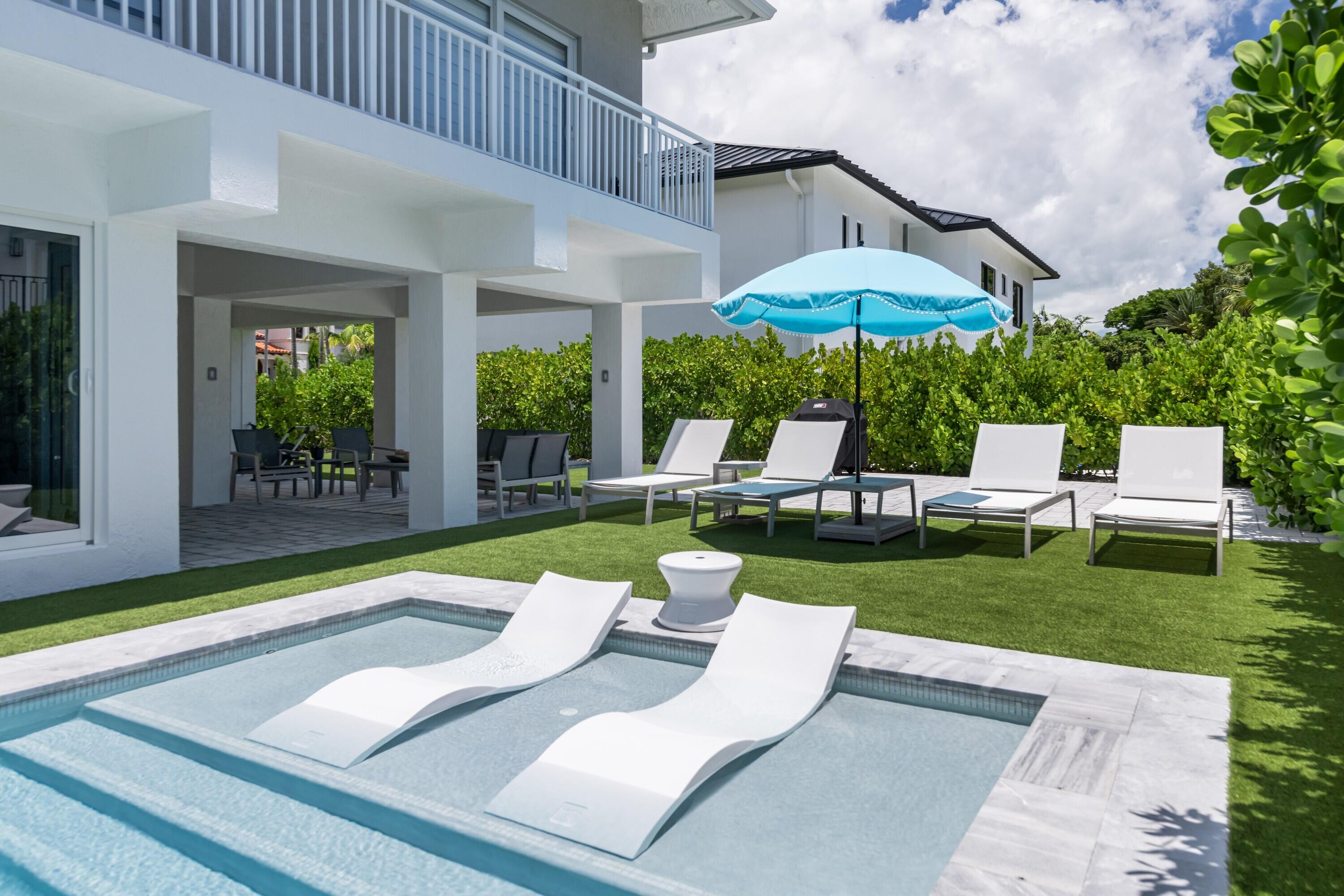227 Corsair Road Marathon, FL 33050 - Photo 13 of 66 a view of a patio with couches chairs and a yard