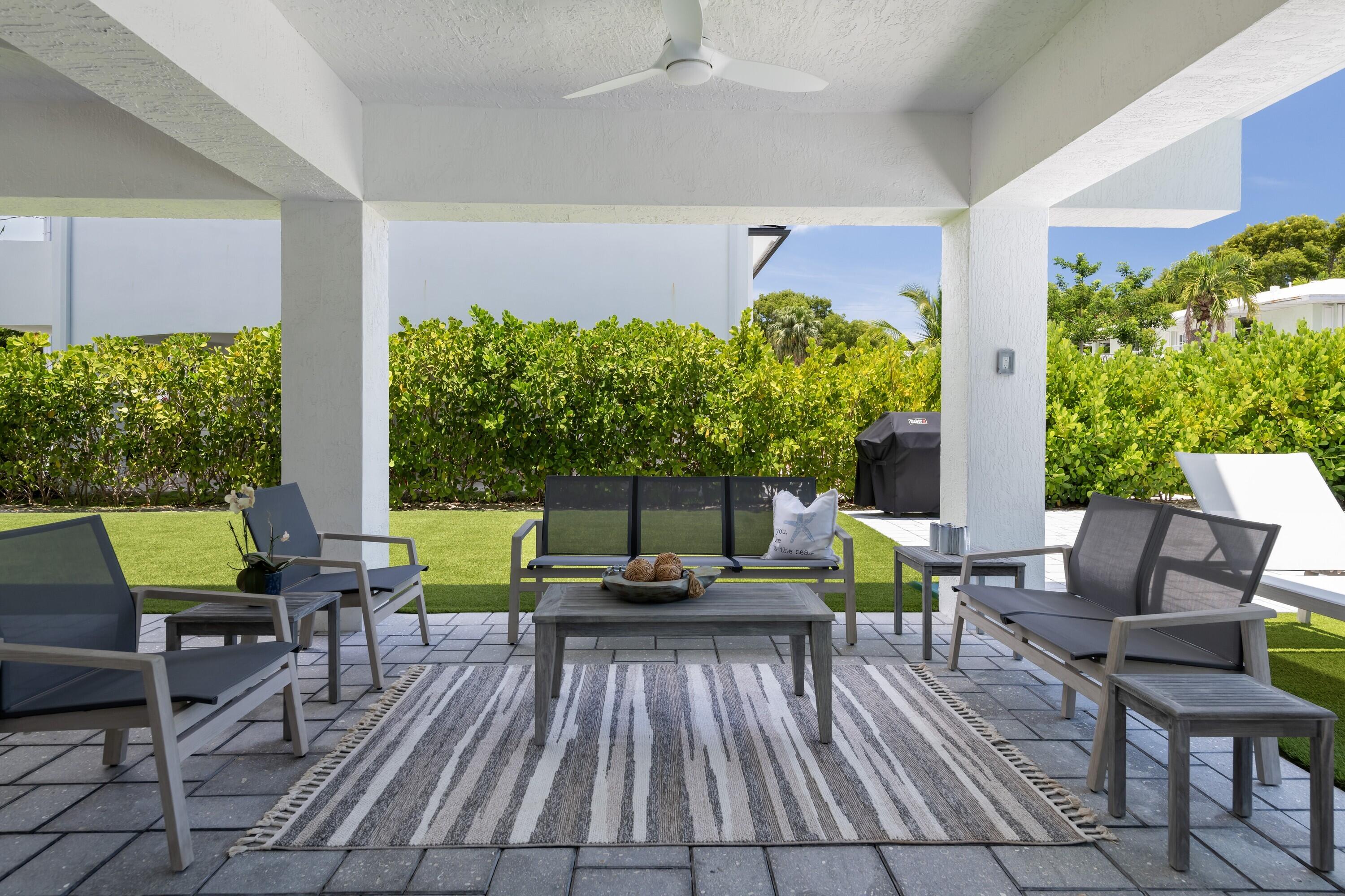 227 Corsair Road Marathon, FL 33050 - Photo 17 of 66 a patio with patio area and outdoor seating