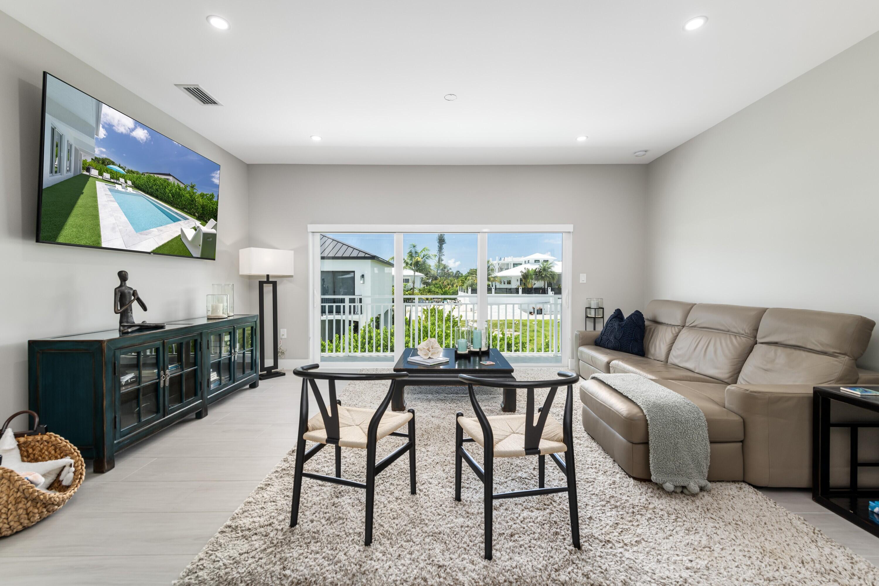 227 Corsair Road Marathon, FL 33050 - Photo 26 of 66 a living room with furniture and a flat screen tv