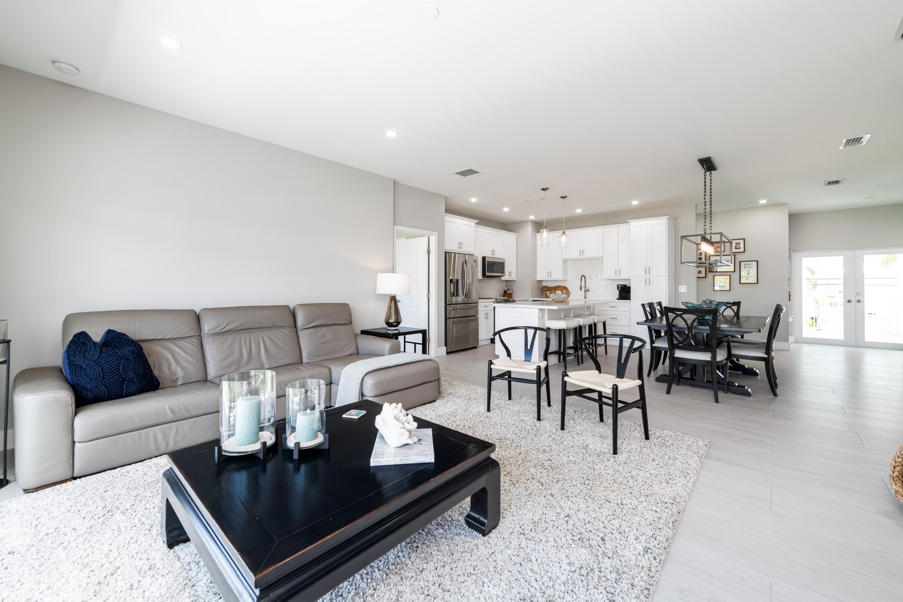 227 Corsair Road Marathon, FL 33050 - Photo 27 of 66 a living room with furniture and kitchen view