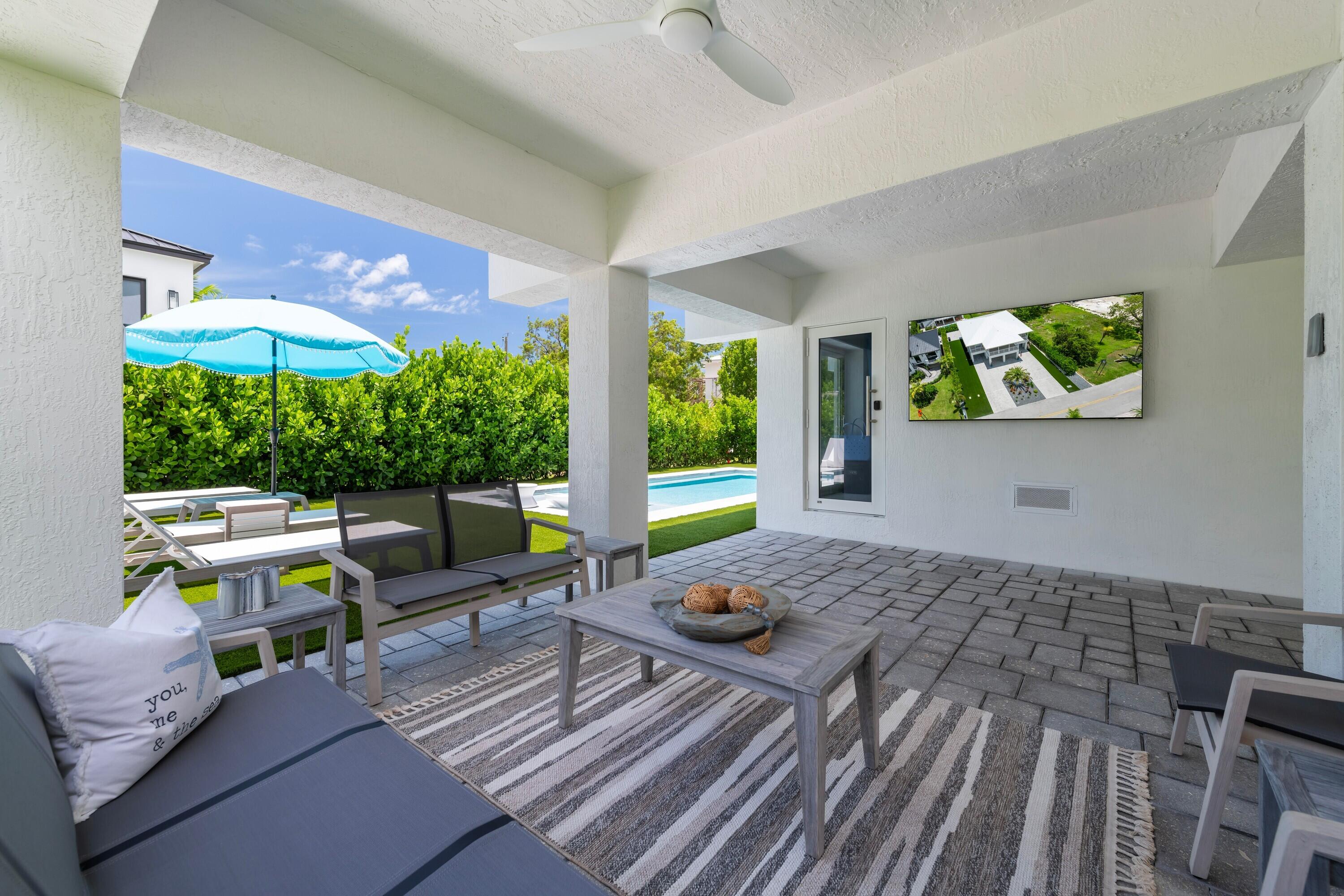227 Corsair Road Marathon, FL 33050 - Photo 3 of 66 a living room with furniture and a large window