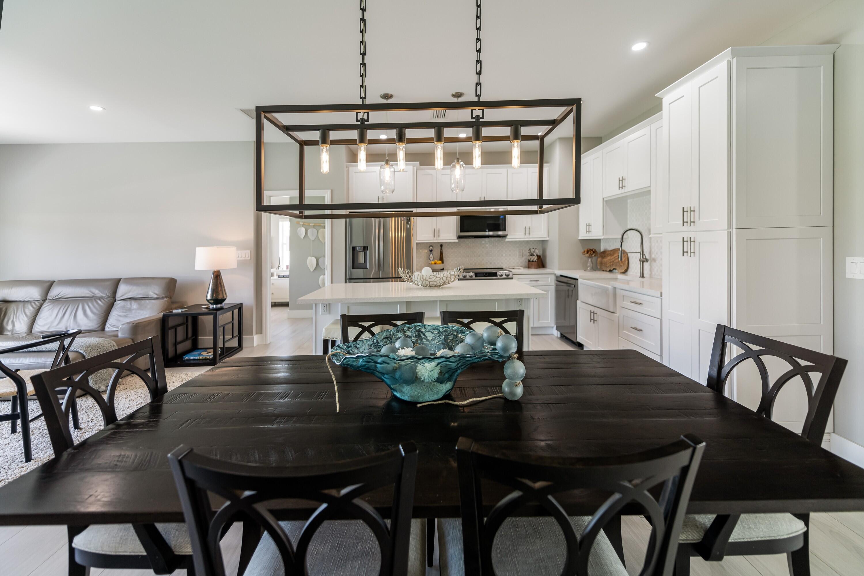 227 Corsair Road Marathon, FL 33050 - Photo 32 of 66 a view of a dining room with furniture and wooden floor