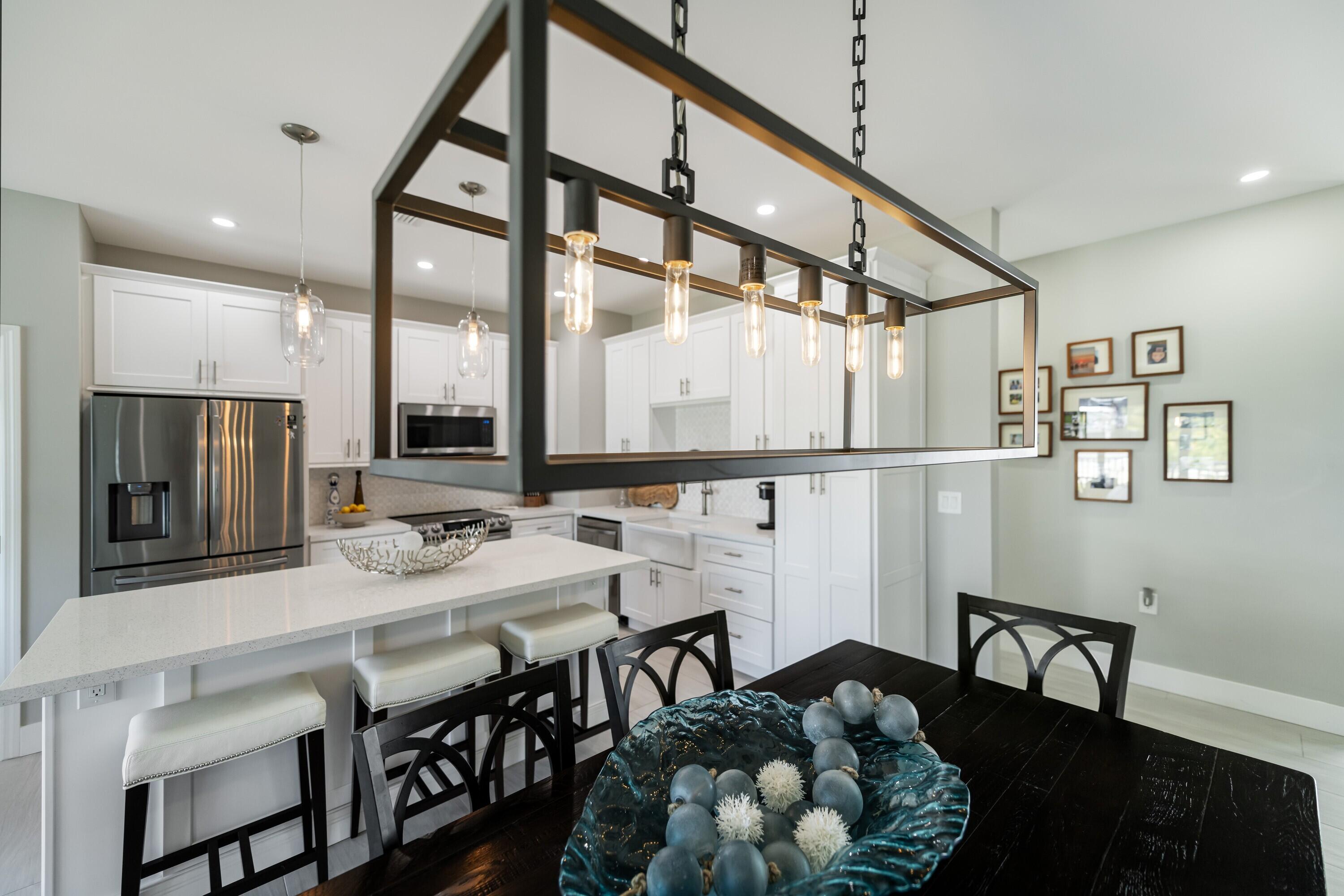 227 Corsair Road Marathon, FL 33050 - Photo 33 of 66 a view of a dining room with furniture window and wooden floor