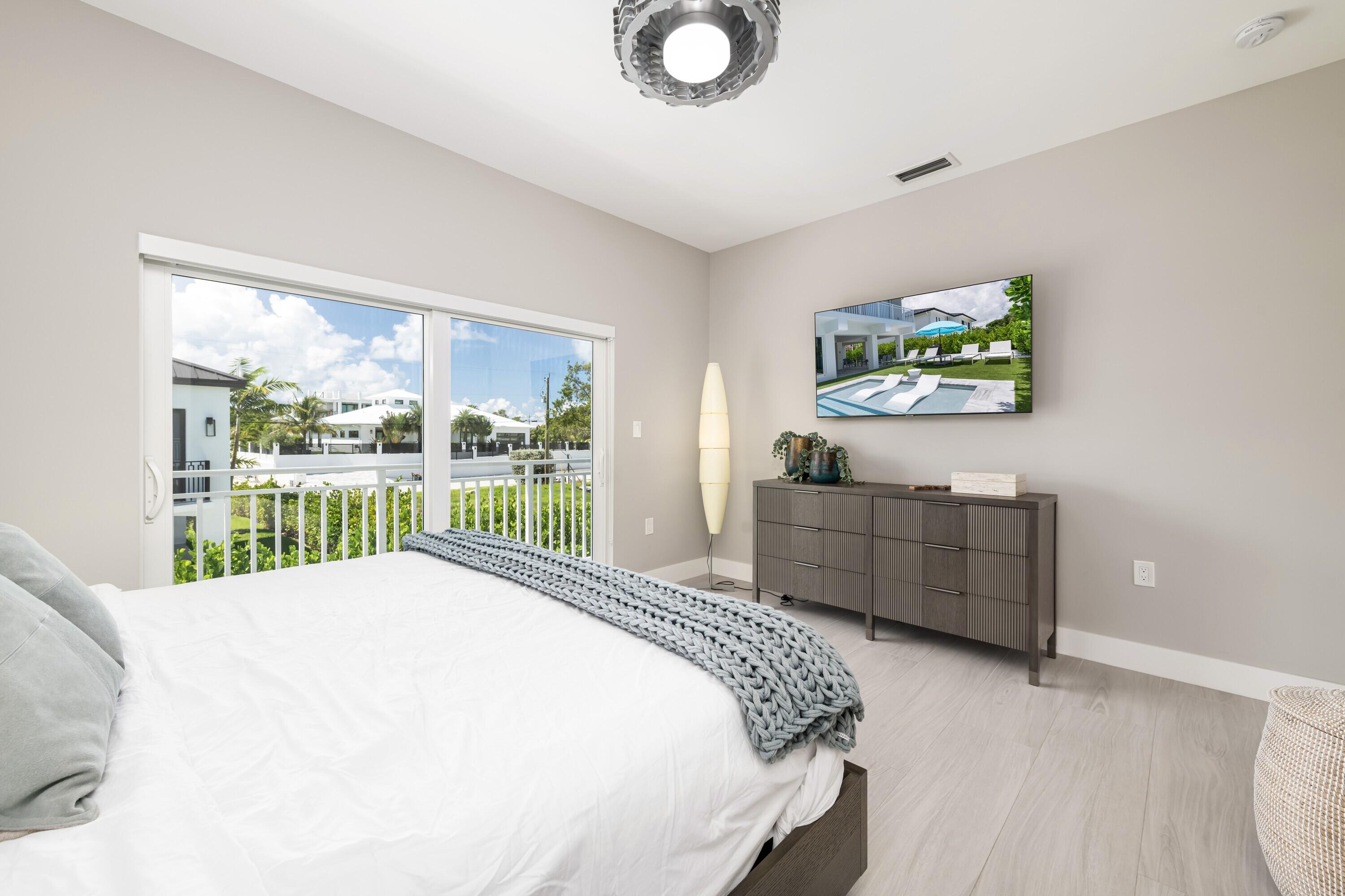 227 Corsair Road Marathon, FL 33050 - Photo 45 of 66 a bed sitting in a bedroom next to a window