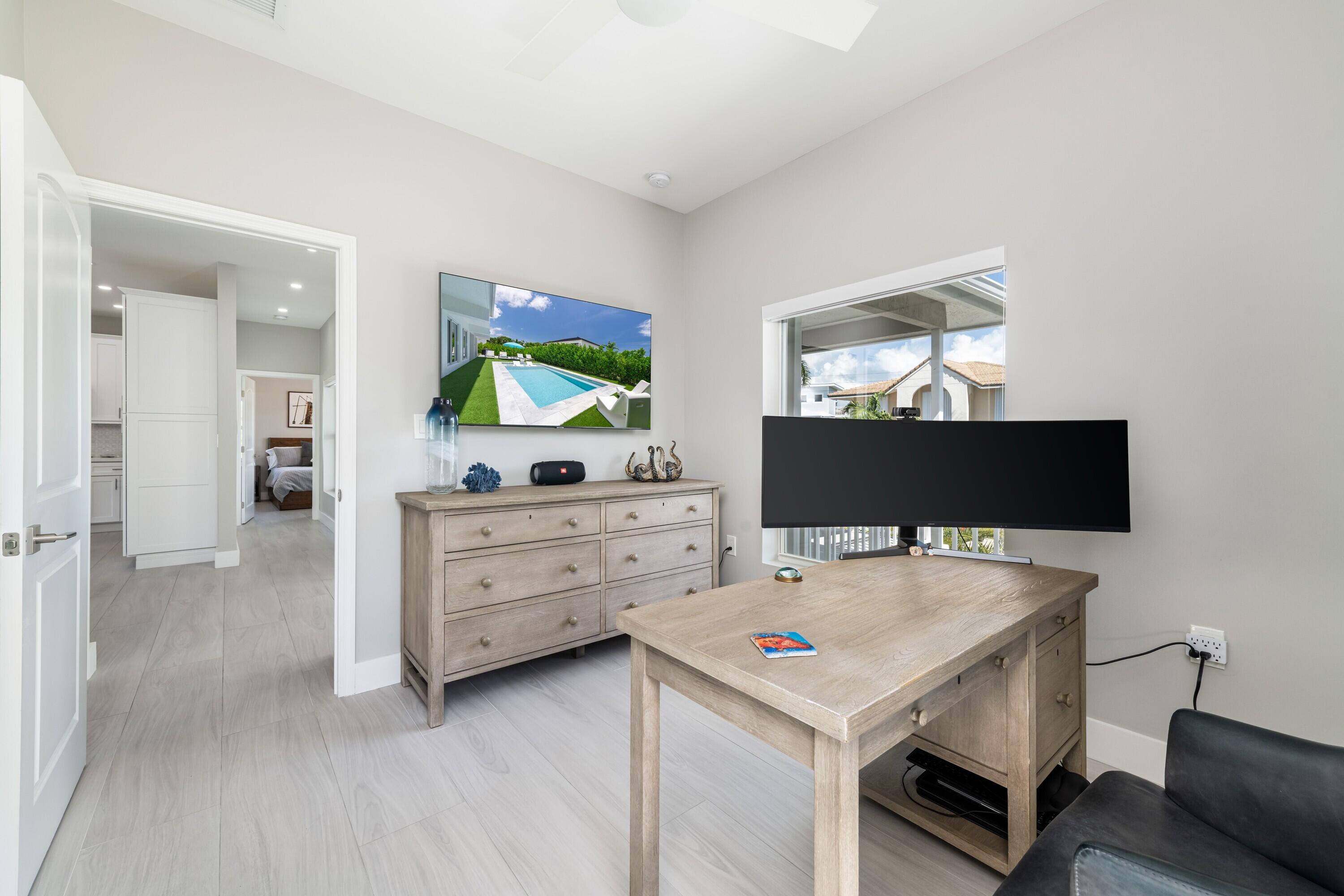 227 Corsair Road Marathon, FL 33050 - Photo 46 of 66 a room with furniture and flat screen tv