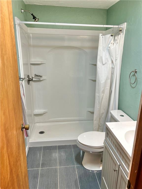 110 Horseshoe Bend Road Prosperity, PA 15329 - Photo 8 of 16 a bathroom with a toilet and a shower