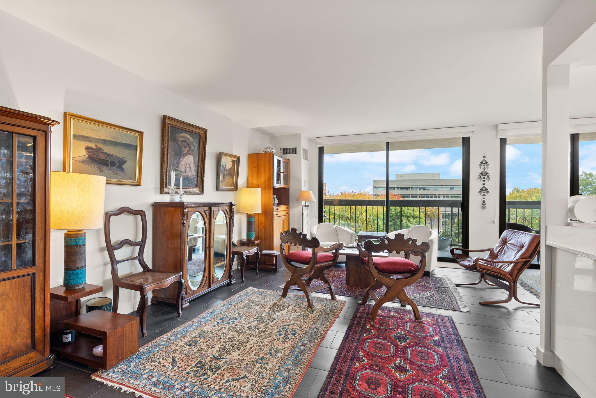 400 Madison Street, Unit 409 Alexandria, VA 22314 - Photo 11 of 98 a living room with furniture or outdoor view and large windows