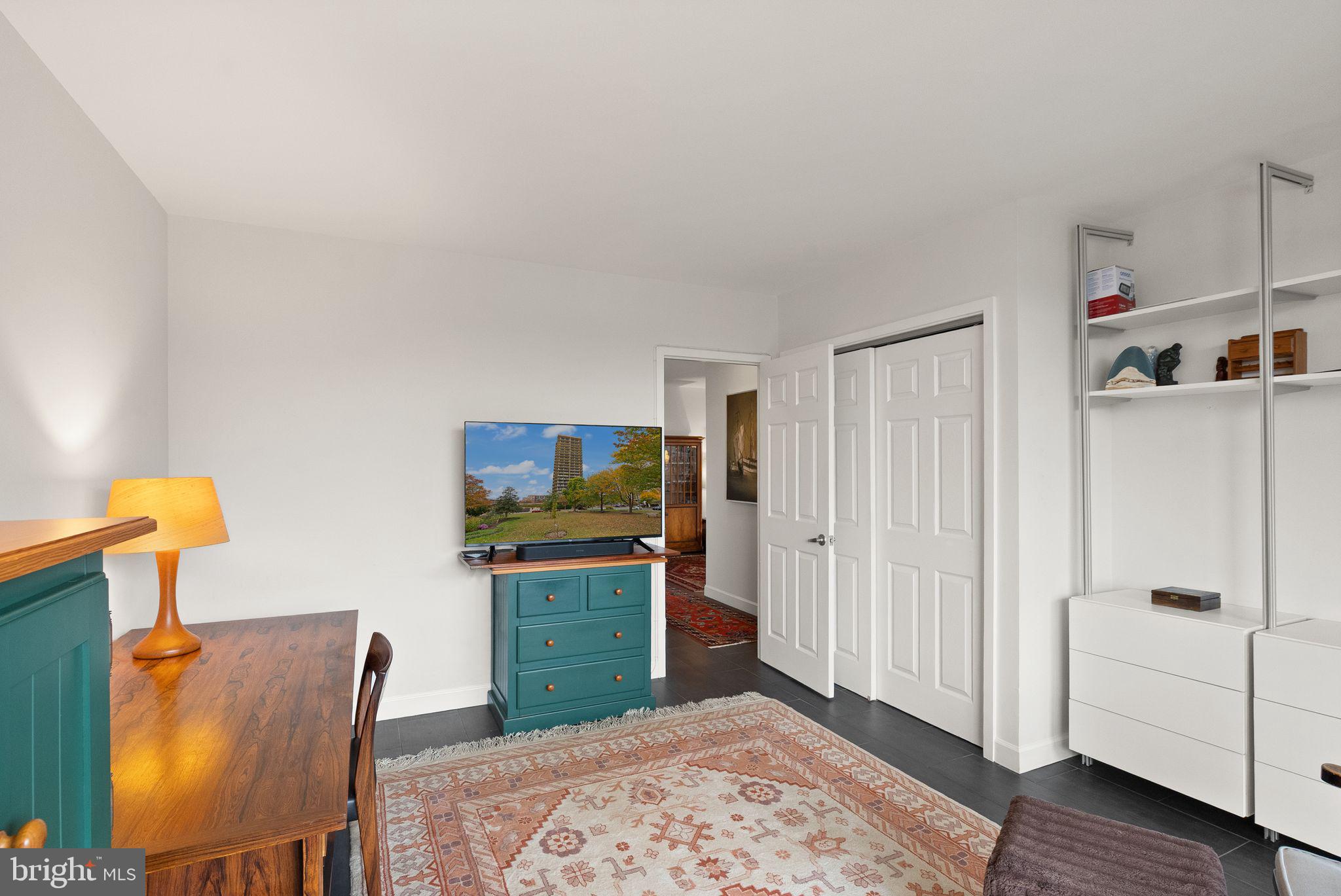 400 Madison Street, Unit 409 Alexandria, VA 22314 - Photo 34 of 98 a room with furniture and a table