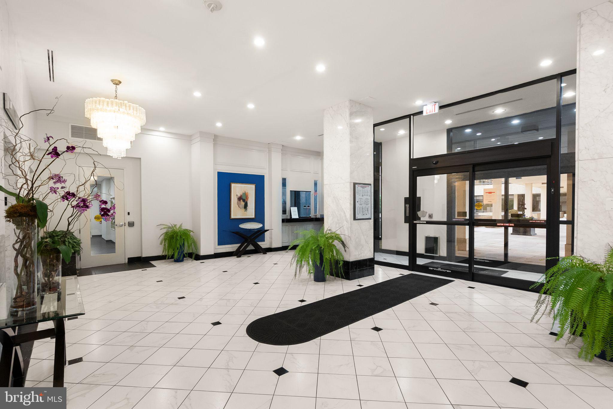 400 Madison Street, Unit 409 Alexandria, VA 22314 - Photo 47 of 98 a view of a lobby with furniture and potted plants