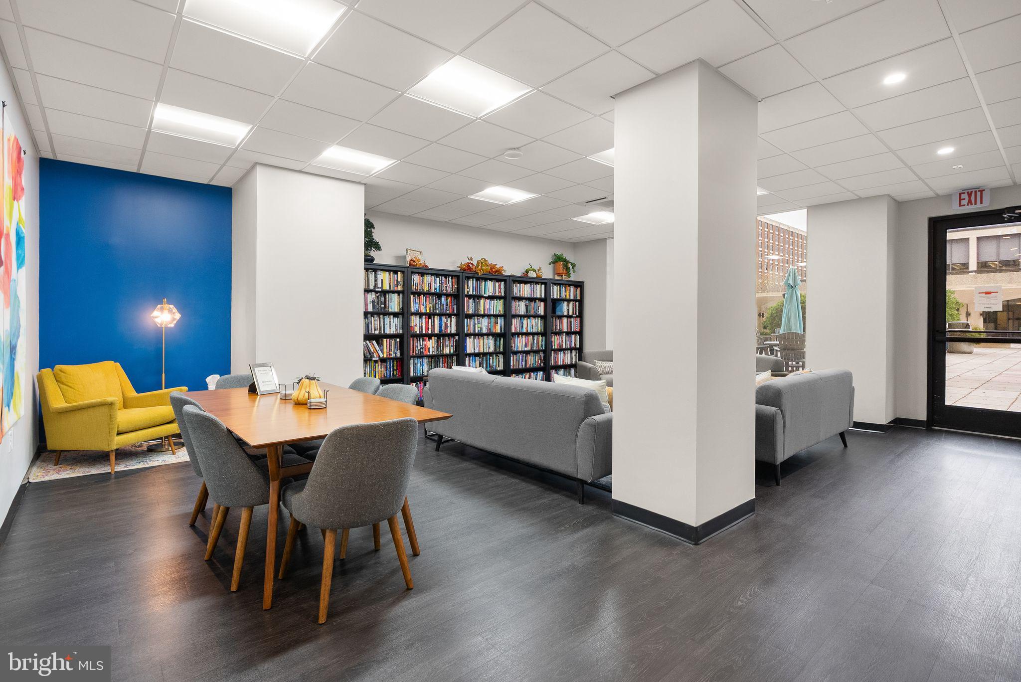 400 Madison Street, Unit 409 Alexandria, VA 22314 - Photo 50 of 98 a dining room with furniture and wooden floor