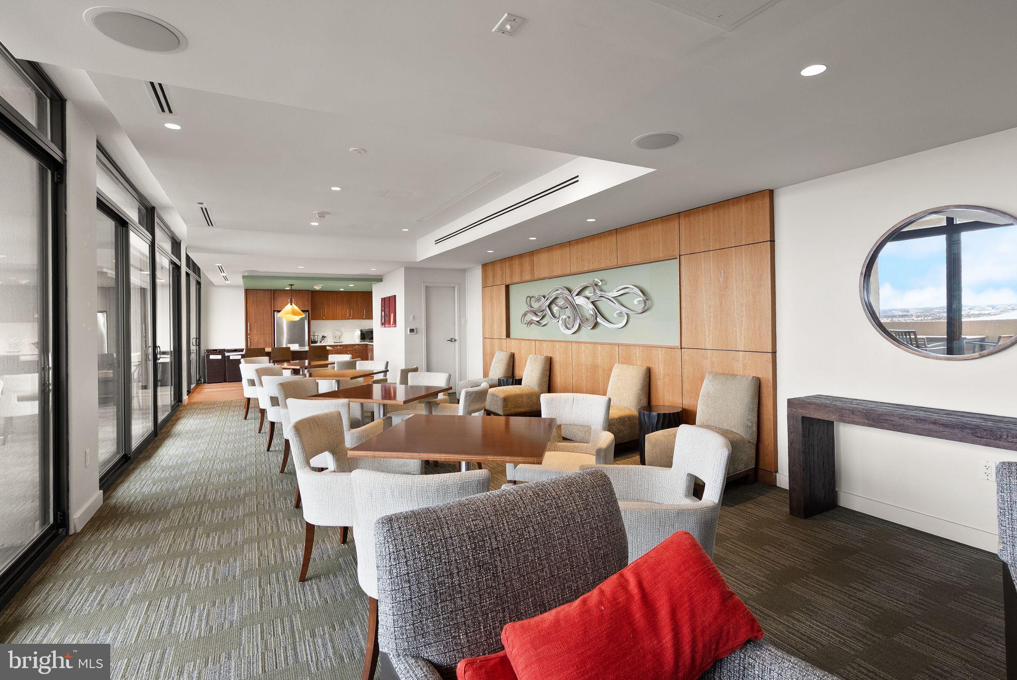 400 Madison Street, Unit 409 Alexandria, VA 22314 - Photo 57 of 98 a living room with furniture a rug and a large window