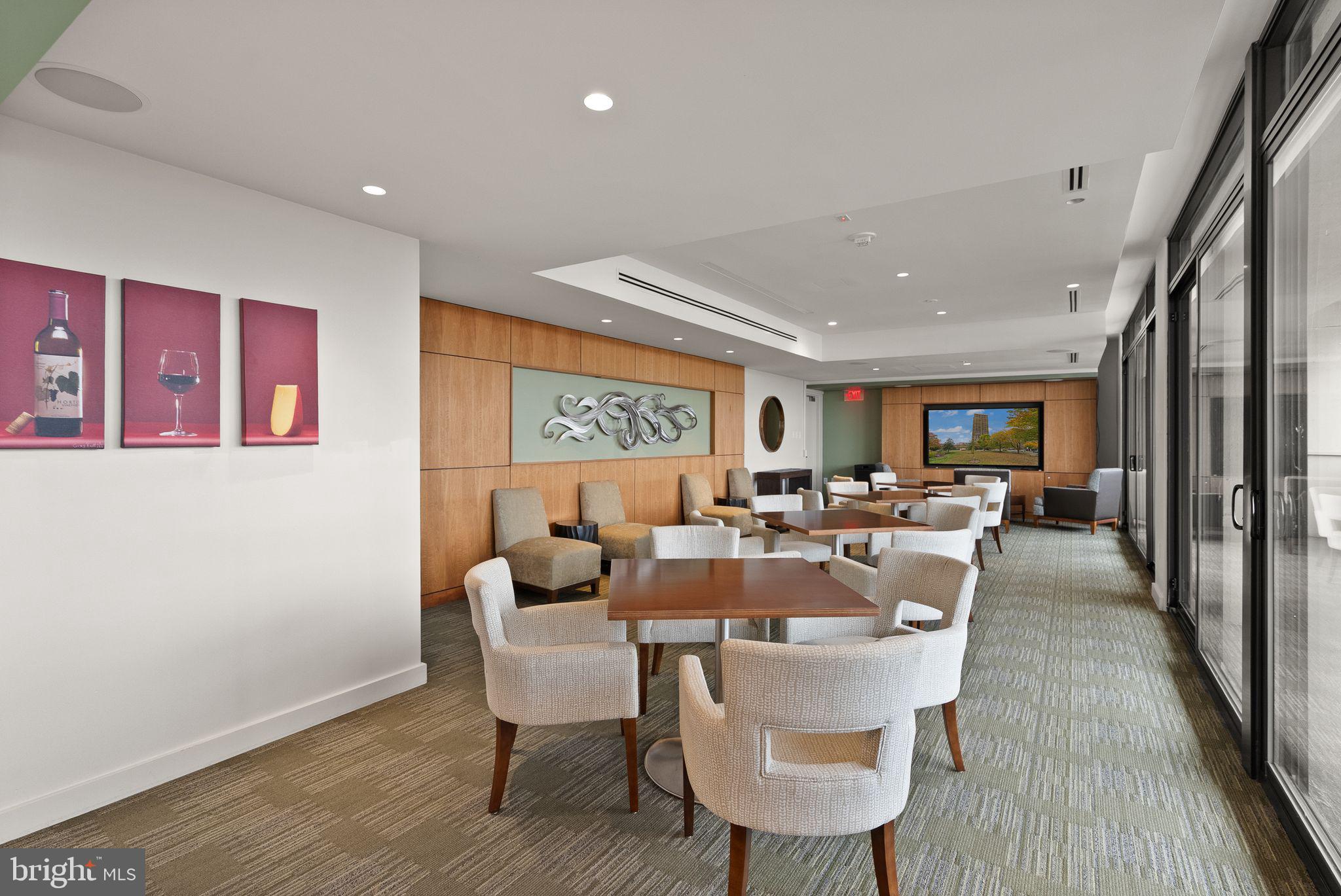 400 Madison Street, Unit 409 Alexandria, VA 22314 - Photo 58 of 98 a view of a dining room with furniture window and wooden floor