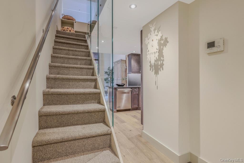 155 West 15th Street, Unit 1E Manhattan, NY 10011 - Photo 11 of 29 a view of staircase with white walls