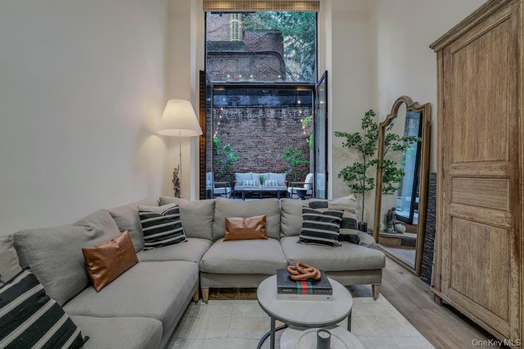 155 West 15th Street, Unit 1E Manhattan, NY 10011 - Photo 2 of 29 a living room with furniture and a fireplace