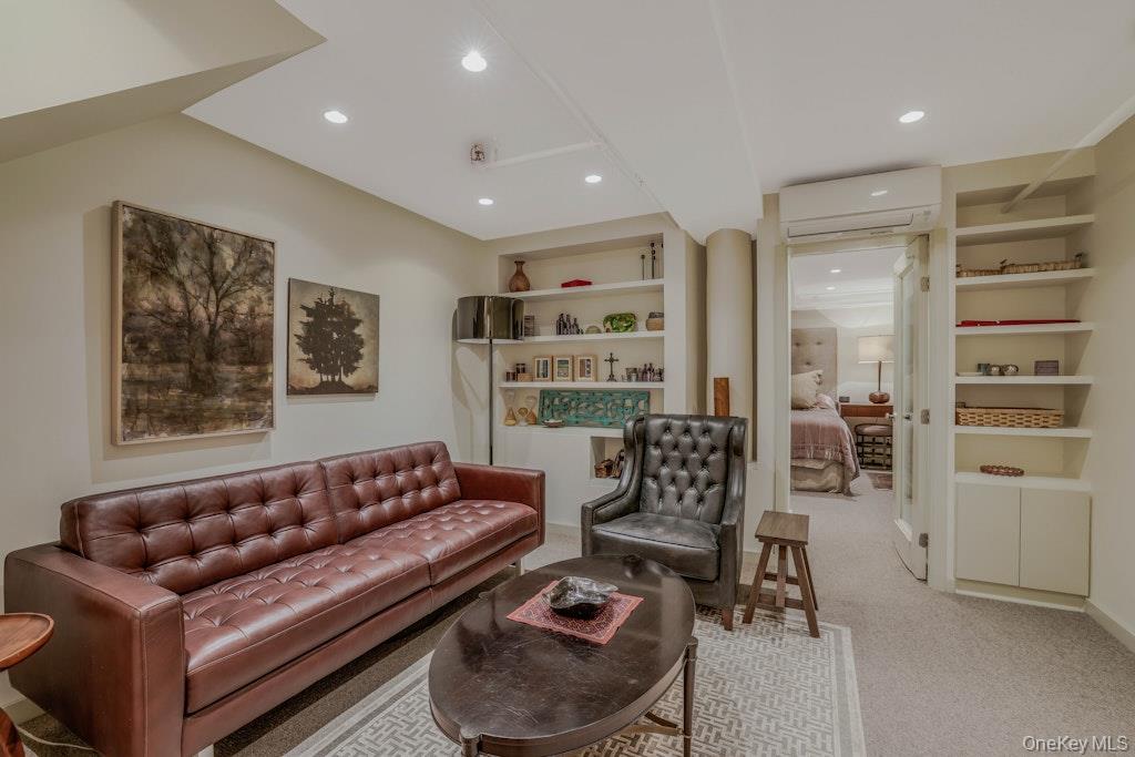 155 West 15th Street, Unit 1E Manhattan, NY 10011 - Photo 21 of 29 a living room with furniture and a large window