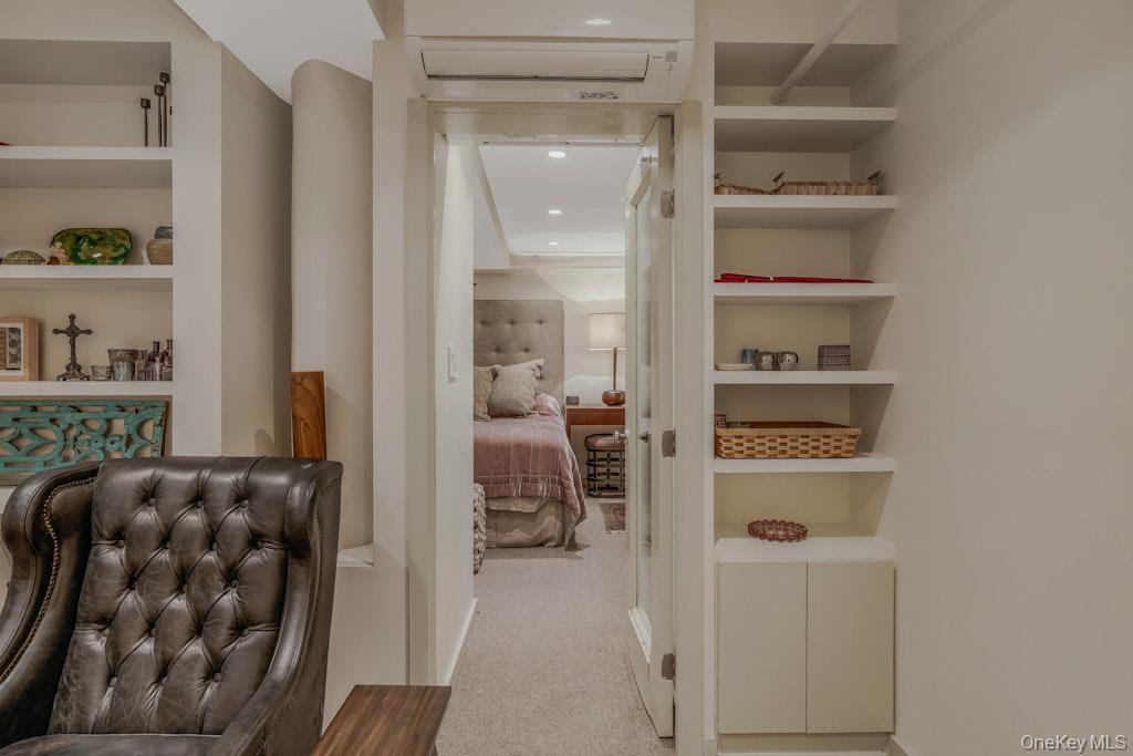 155 West 15th Street, Unit 1E Manhattan, NY 10011 - Photo 23 of 29 a view of walk in closet with clothes and shoes