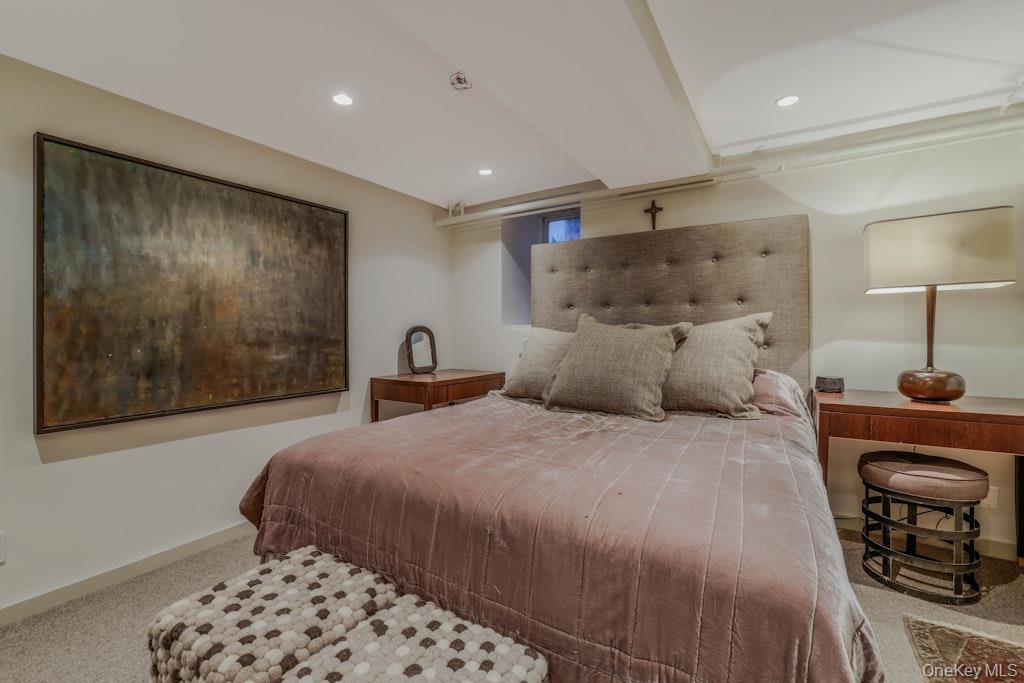 155 West 15th Street, Unit 1E Manhattan, NY 10011 - Photo 24 of 29 a bedroom with a bed and a lamp with table