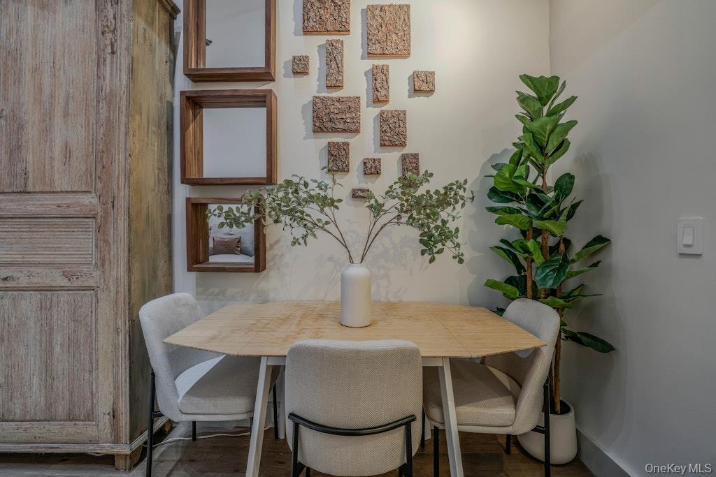 155 West 15th Street, Unit 1E Manhattan, NY 10011 - Photo 9 of 29 a view of a dining room with furniture and wooden floor