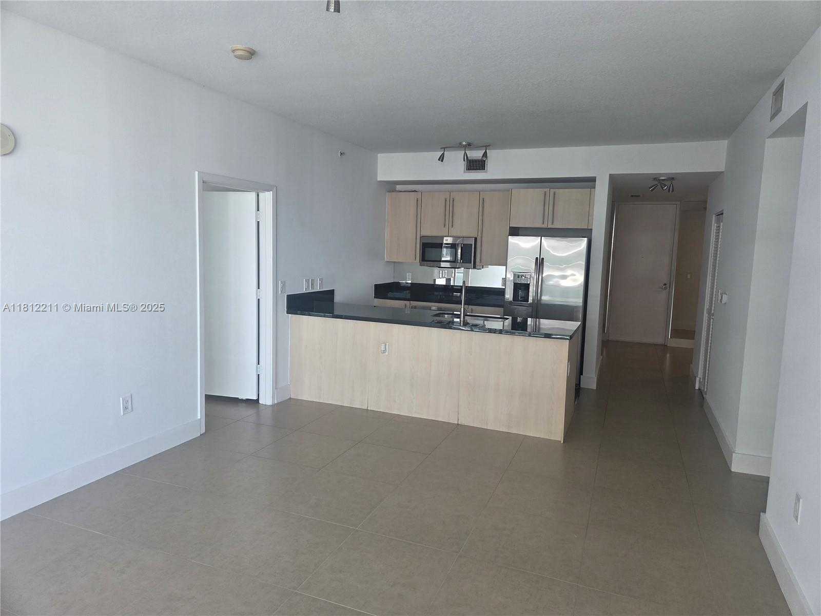 79 Southwest 12th Street, Unit 2409 Miami, FL 33130 - Photo 4 of 13 a view of a kitchen with a sink