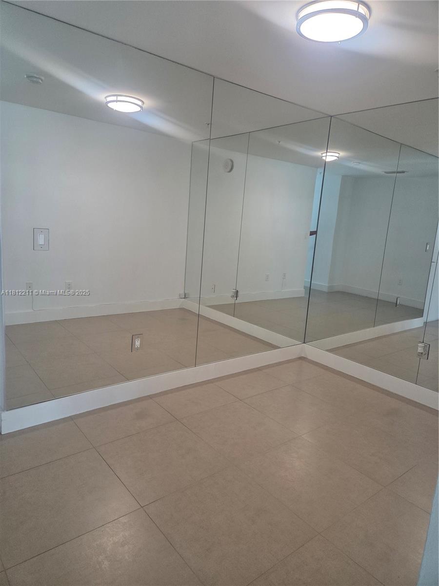 79 Southwest 12th Street, Unit 2409 Miami, FL 33130 - Photo 5 of 13 a view of a room with an empty space