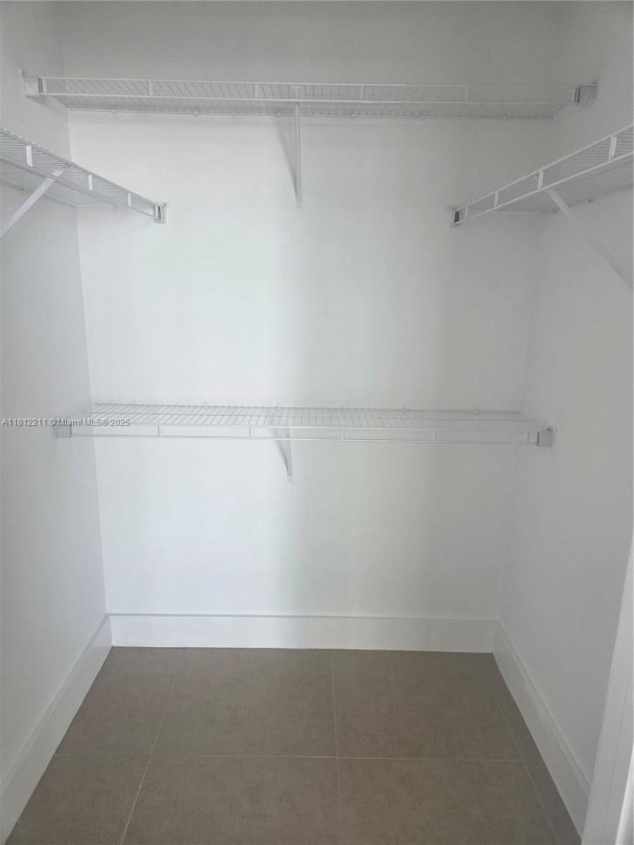 79 Southwest 12th Street, Unit 2409 Miami, FL 33130 - Photo 8 of 13 a view of an empty walk in closet