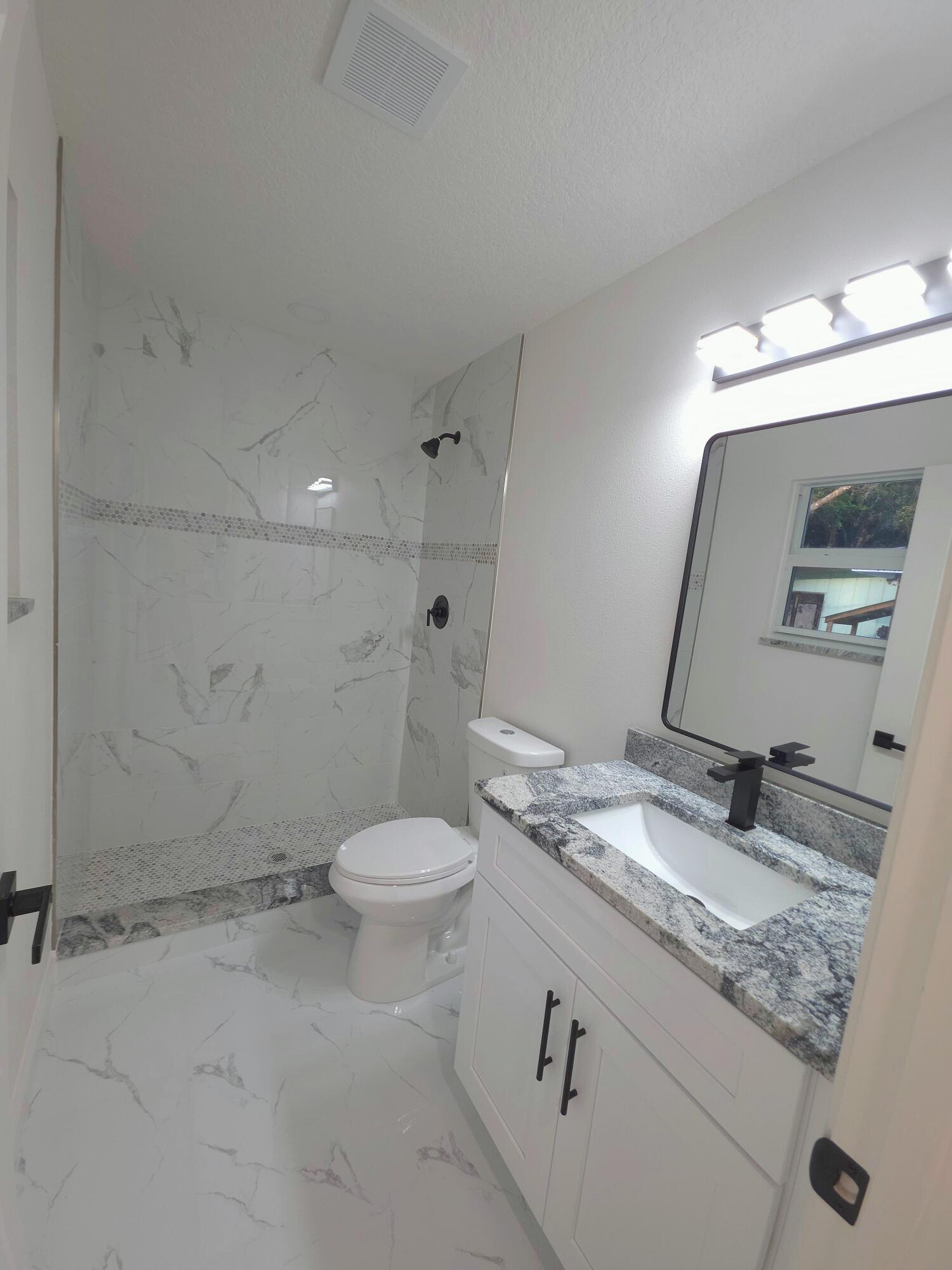 8001 Hibiscus Road Fort Pierce, FL 34951 - Photo 9 of 10 8001-hibiscus-road-bathroom-enhanced