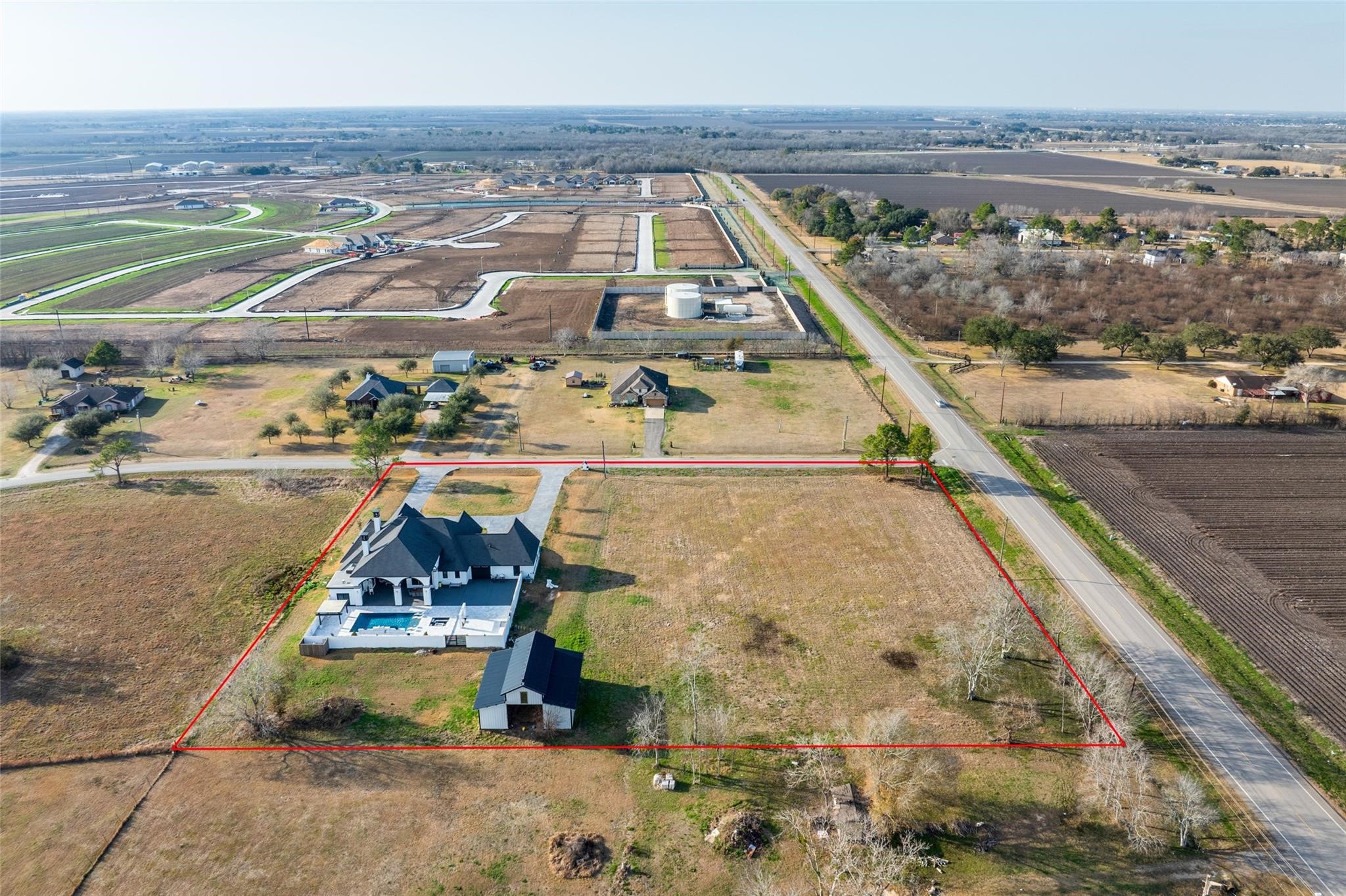 4821 Walters Road Richmond, TX 77469 - Photo 48 of 50 Situated on 3.117 unrestricted acres, this aerial view illustrates the property’s impressive size, open land, and potential for agricultural, residential, or commercial use (buyer to verify)