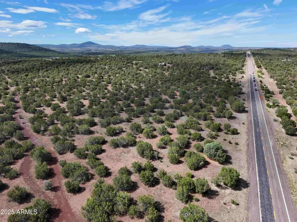 a view of an outdoor space with wooden fence
