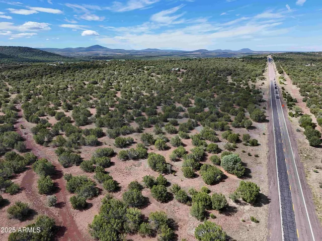 a view of an outdoor space with wooden fence
