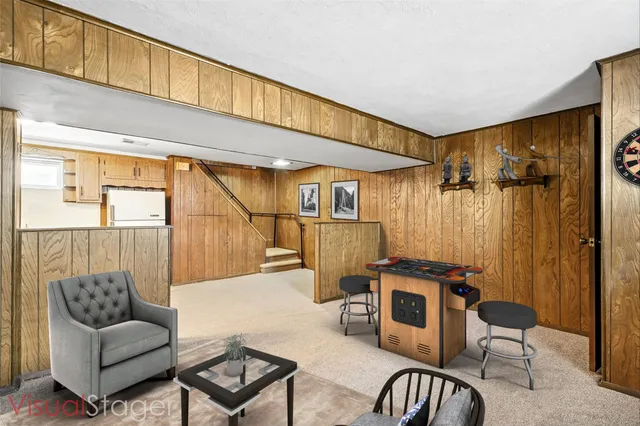 a living room with furniture a rug and a window