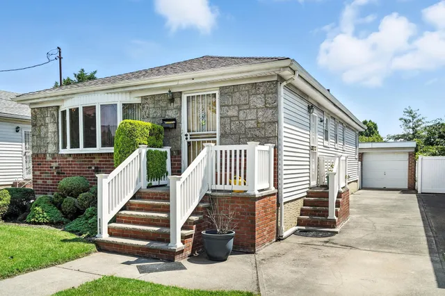 a front view of a house with a porch