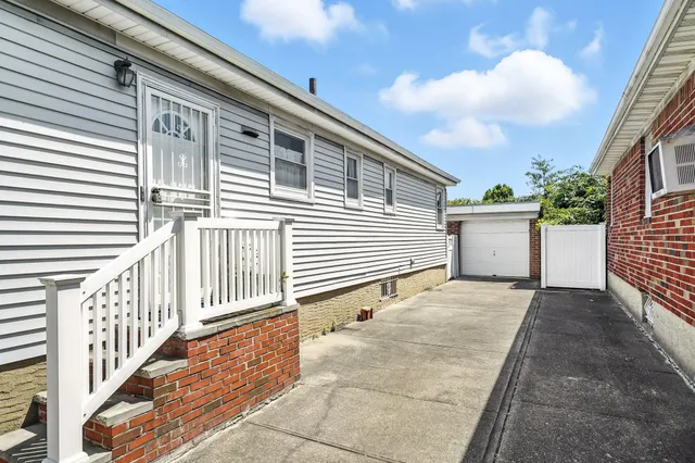 a backyard of a house with wooden floor