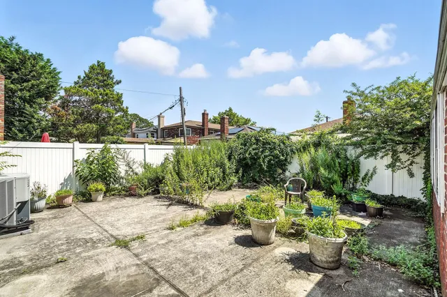 a view of a backyard with sitting area