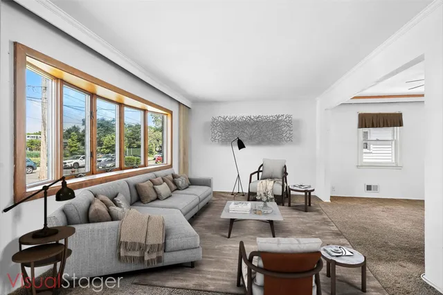 a living room with furniture and a large window