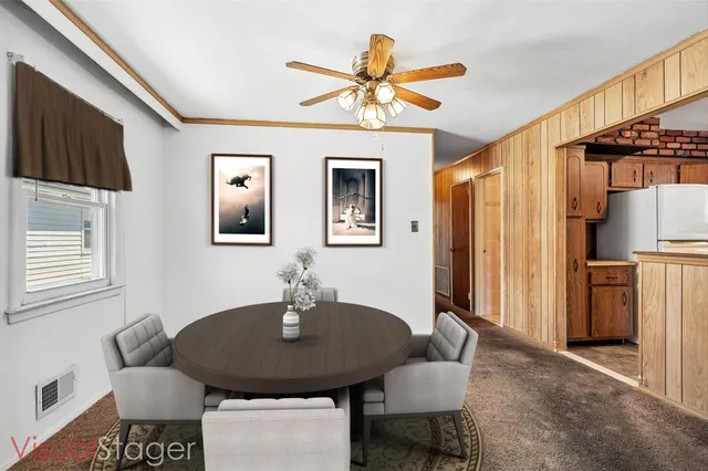a dining room with furniture and window