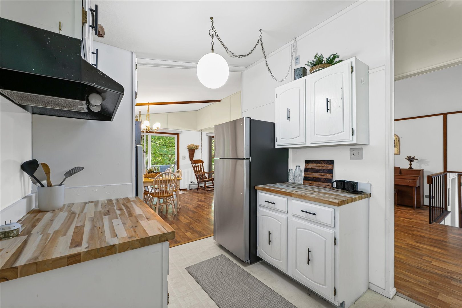 5 Allison Drive Paxton, IL 60957 - Photo 13 of 34 a kitchen with a refrigerator a stove a sink and white cabinets