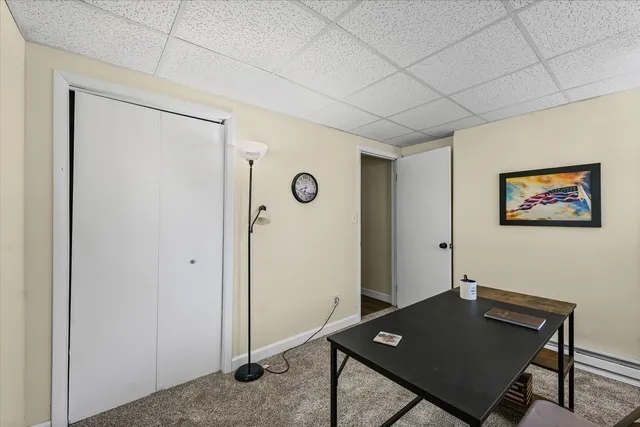 a living room with a table and chairs