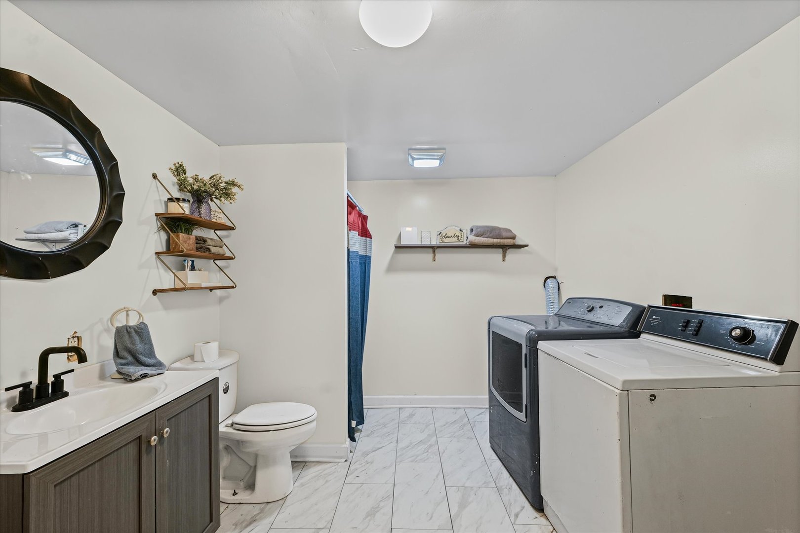 5 Allison Drive Paxton, IL 60957 - Photo 24 of 34 a bathroom with a toilet a sink and a mirror