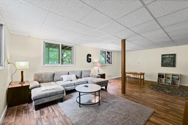 a living room with furniture and a table