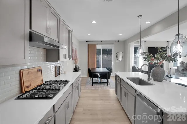 a large bed sitting in a bedroom next to a window