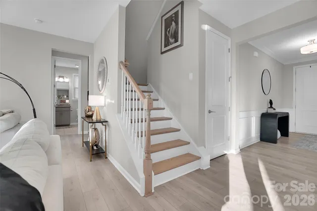 a bathroom with a granite countertop sink a potted plant and a mirror