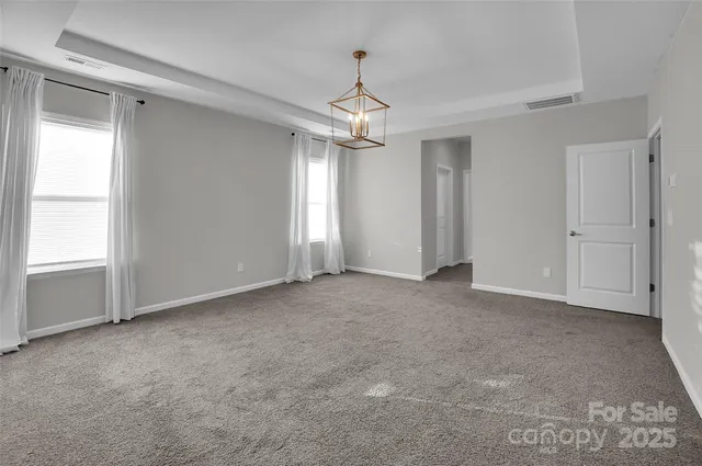 a large bathroom with a sink mirror and a bathtub