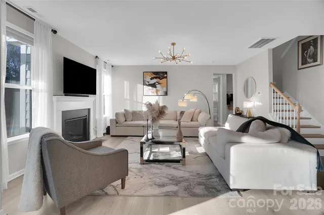a kitchen with white cabinets and appliances