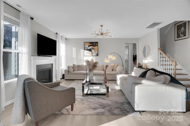 a living room with furniture and white walls