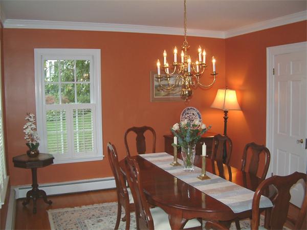 5 Berwick Road Lexington, MA 02420 - Photo 3 of 9 a view of a dining room with furniture a chandelier and large windows