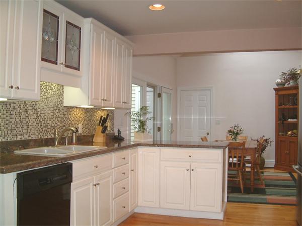 5 Berwick Road Lexington, MA 02420 - Photo 7 of 9 a kitchen with white cabinets and sink