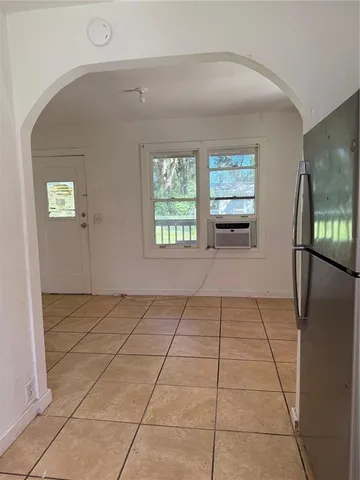 a view of a livingroom with an empty space and window