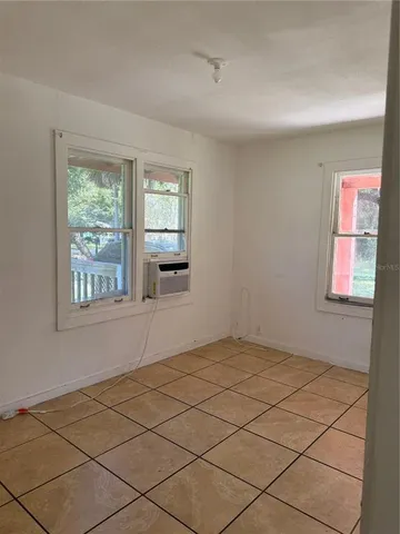 a view of an empty room and window