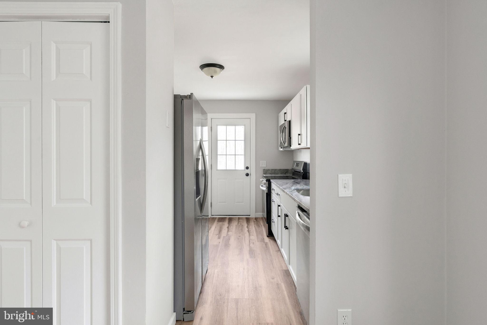 2174 Copper Line Road Bumpass, VA 23024 - Photo 11 of 45 Bright and inviting kitchen corridor.