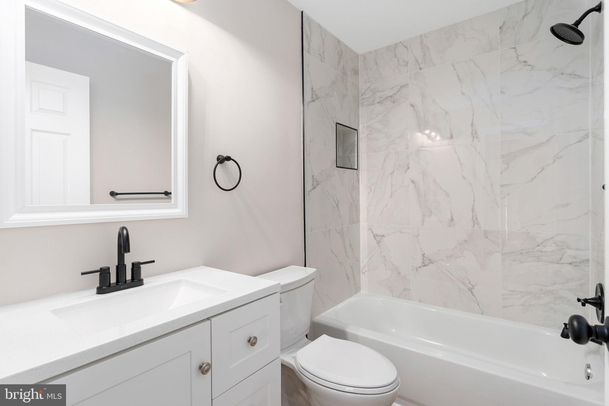 2174 Copper Line Road Bumpass, VA 23024 - Photo 20 of 45 a bathroom with a sink a toilet and bathtub